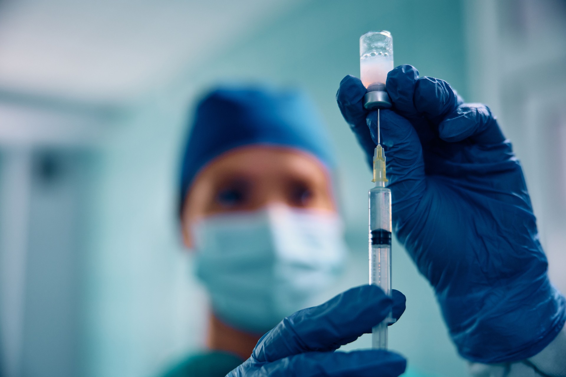 Close up of nurse preparing medical injection in the operating room.